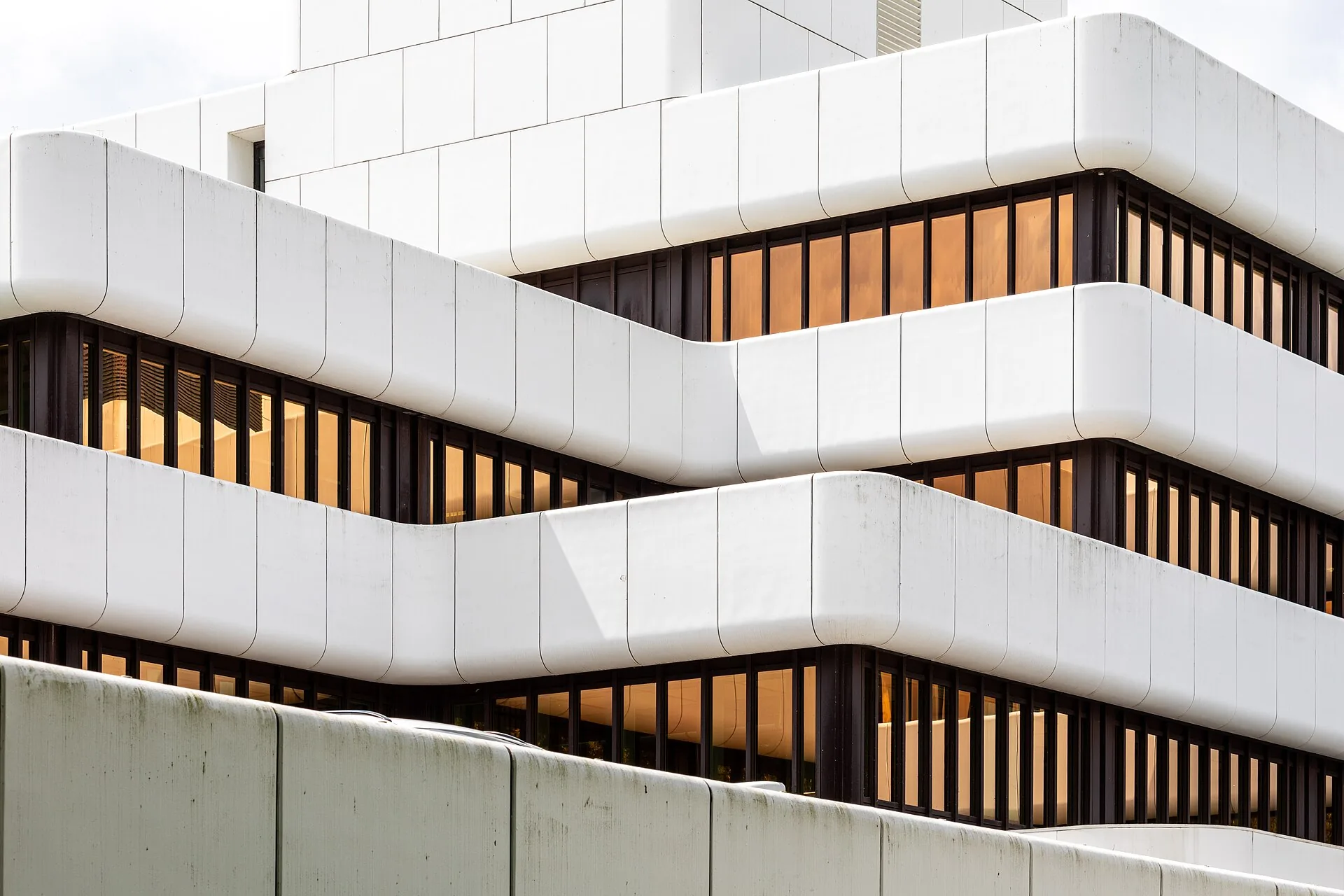 Office building with stacked white horizontal bands