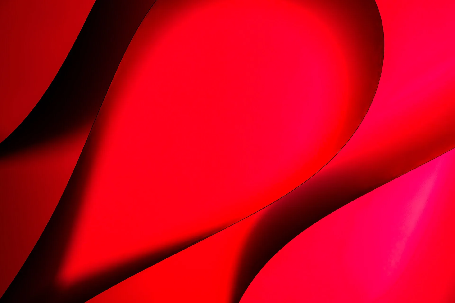 Overlapping curved red paper edges