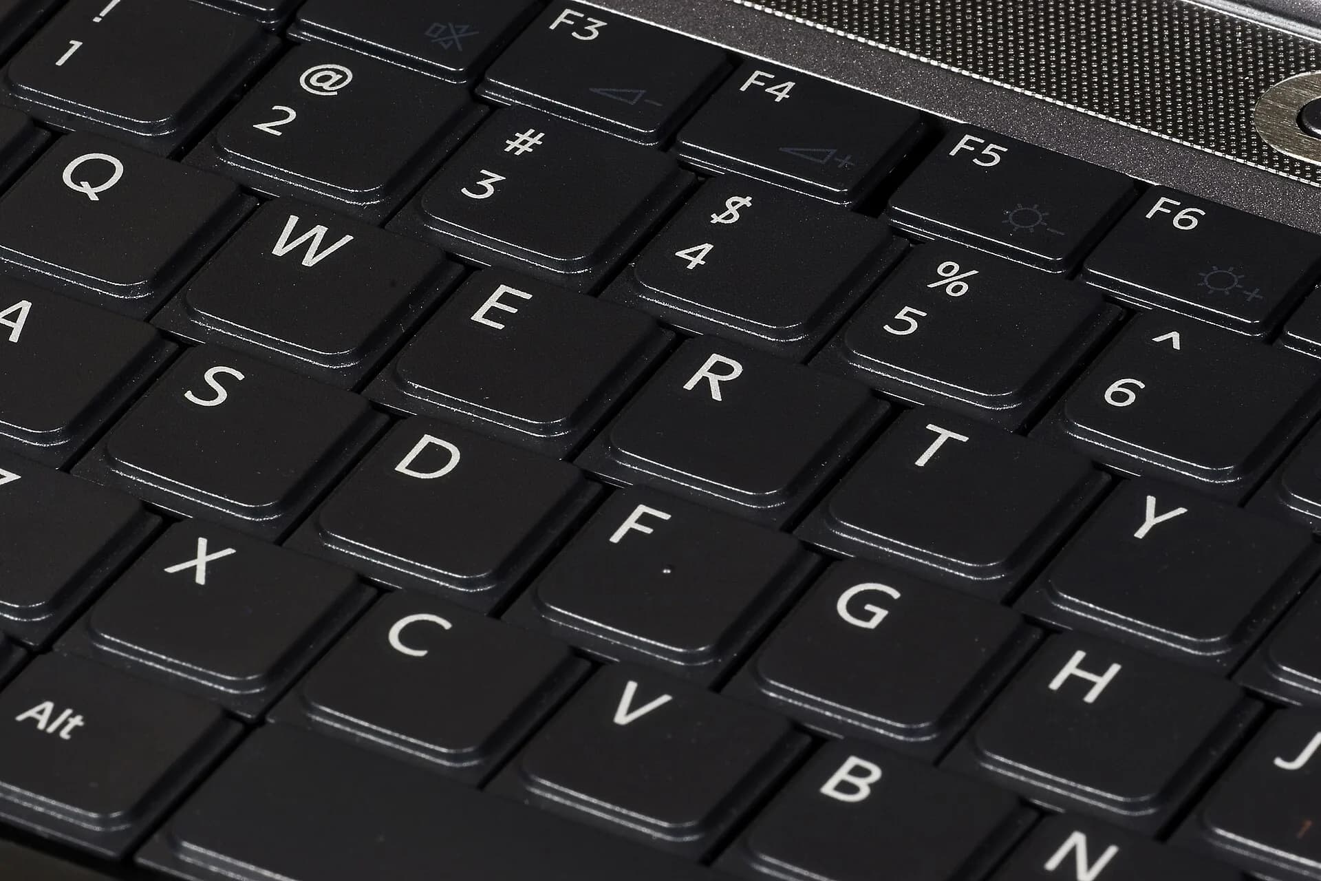 Close-up of black laptop keys at an angle